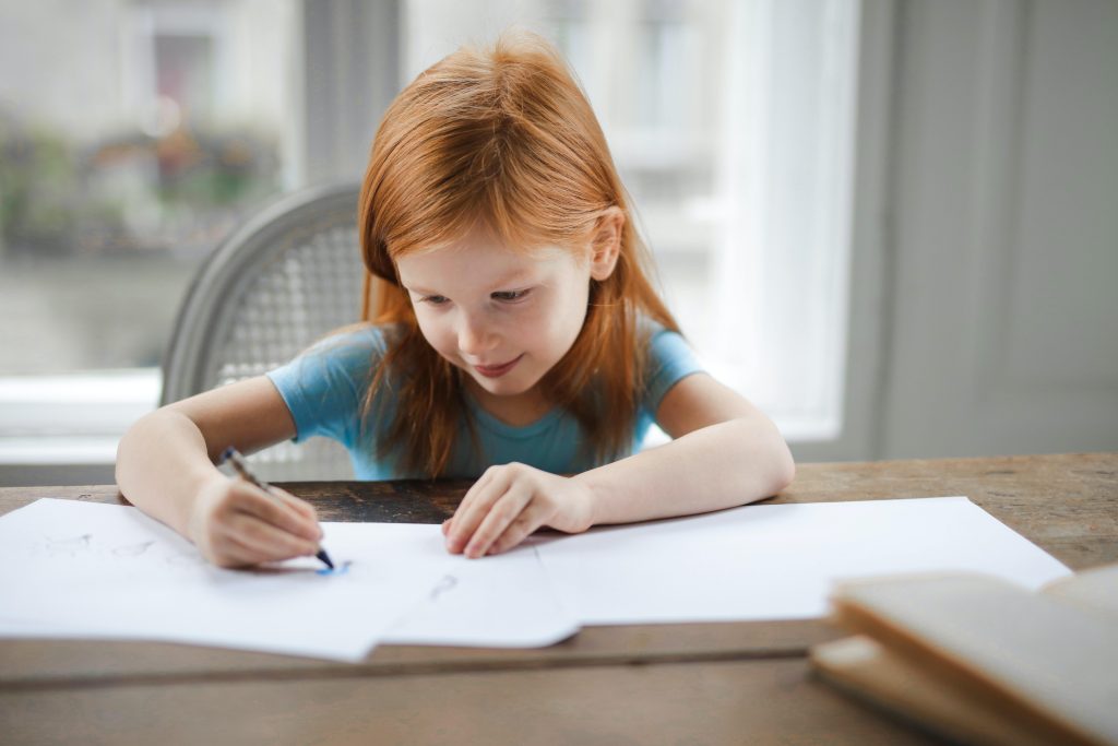 Young girl engaged doing school work