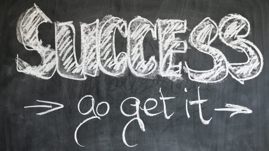 Success sign on a blackboard - go get it.