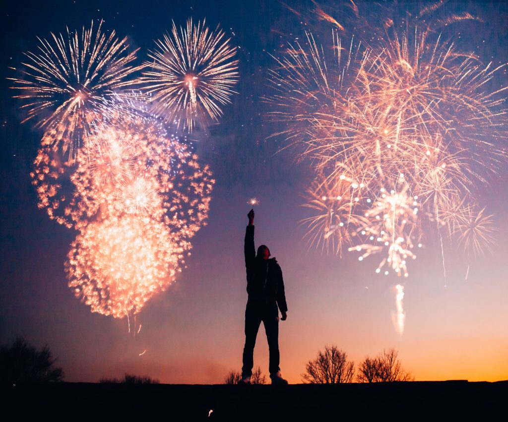 Man watching New Year's Eve fireworks