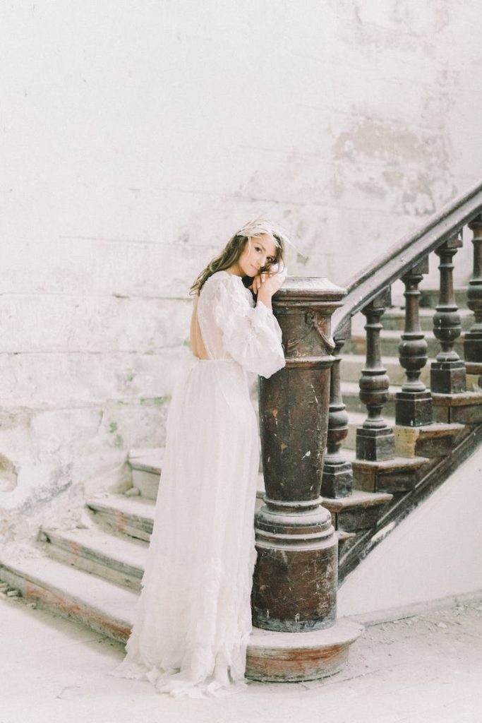 Dressed in white on staircase