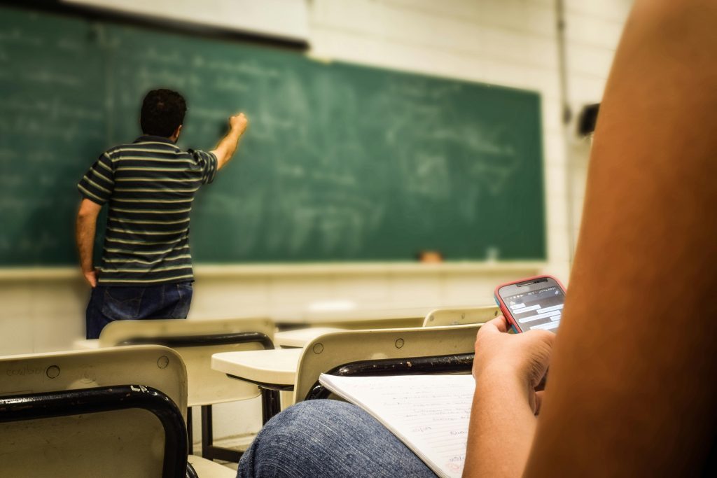 Teacher in front of pupil