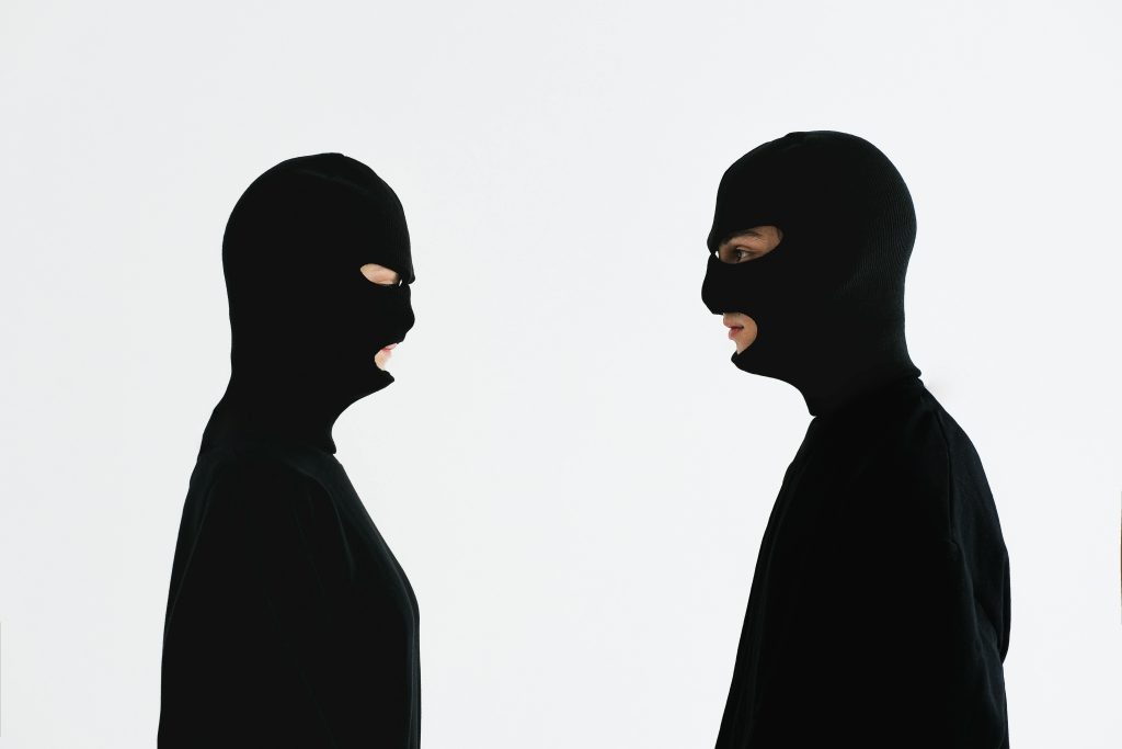 Two men in balaclavas